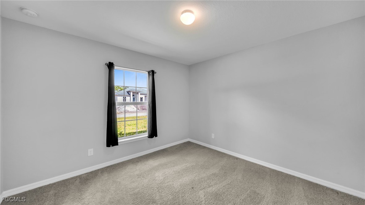 767 Roma Avenue South Lehigh Acres, FL 33974 - Photo 23 of 34 an empty room with window