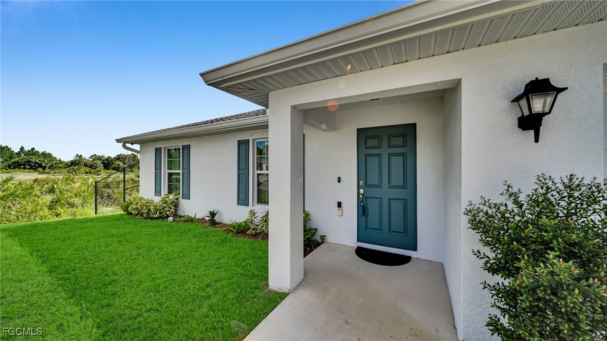 767 Roma Avenue South Lehigh Acres, FL 33974 - Photo 3 of 34 a view of a house with backyard