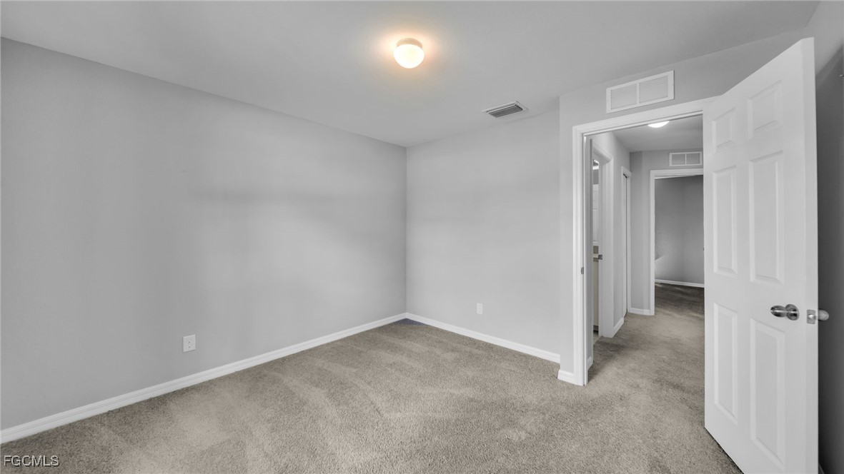 767 Roma Avenue South Lehigh Acres, FL 33974 - Photo 32 of 34 a view of an empty room and a windows