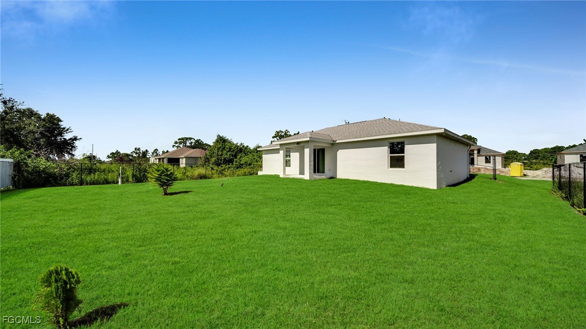 767 Roma Avenue South Lehigh Acres, FL 33974 - Photo 6 of 34 a view of a house with backyard