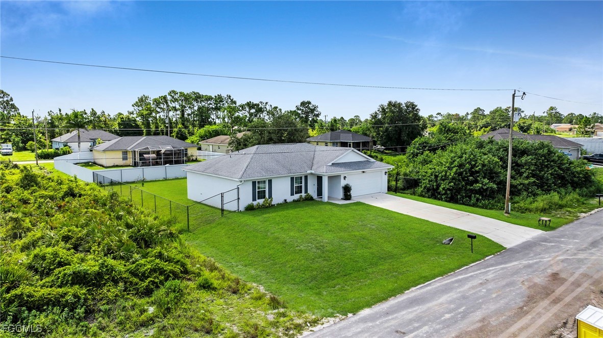 767 Roma Avenue South Lehigh Acres, FL 33974 - Photo 9 of 34 an aerial view of a house