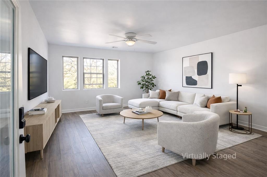 1488 East Forrest Avenue Atlanta, GA 30344 - Photo 6 of 7 a living room with furniture and a flat screen tv