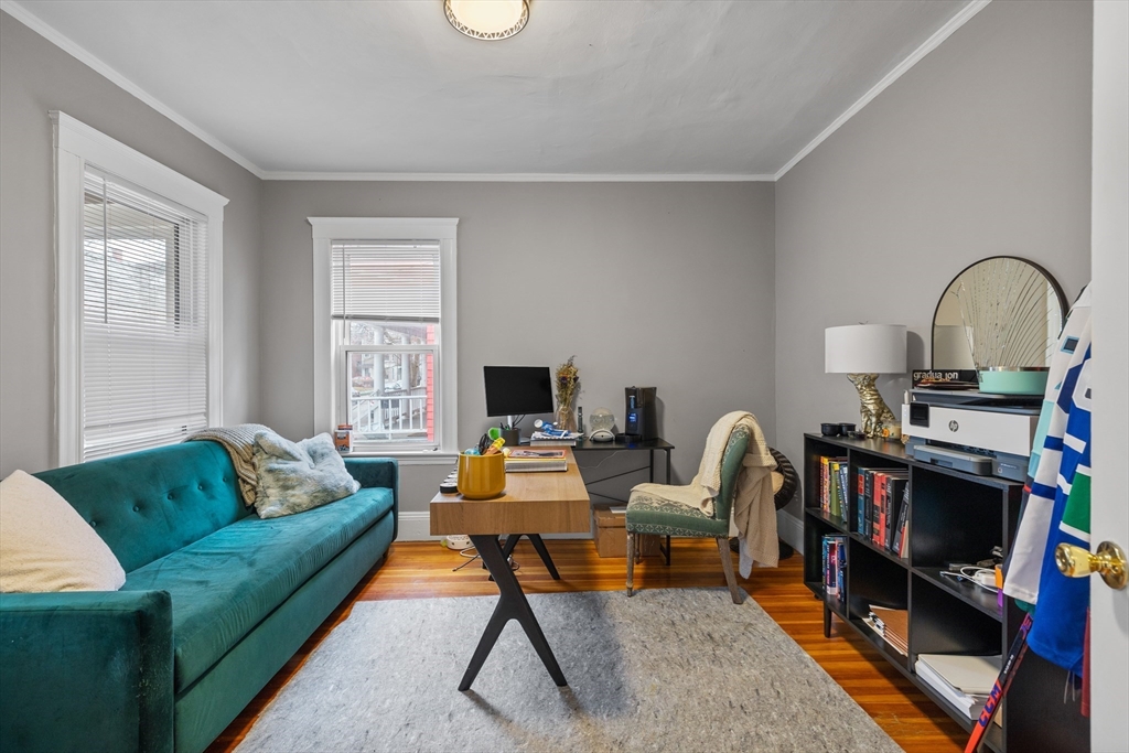 14-16 Malvern Avenue Somerville, MA 02144 - Photo 13 of 39 a living room with furniture and a wooden floor