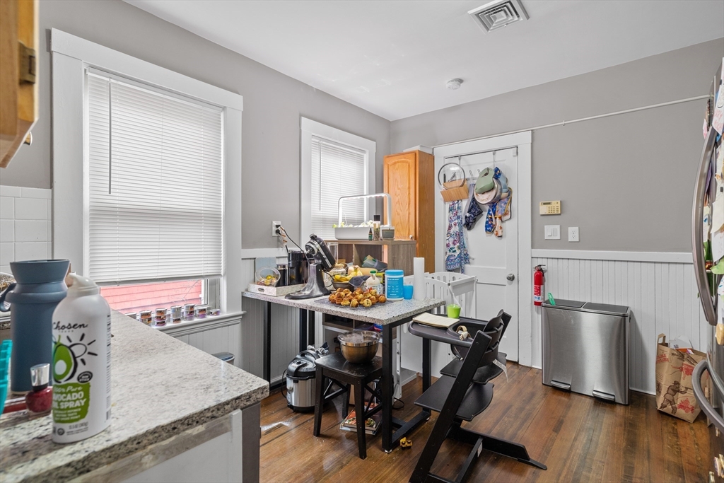 14-16 Malvern Avenue Somerville, MA 02144 - Photo 16 of 39 a view of a dining room with furniture window and wooden floor