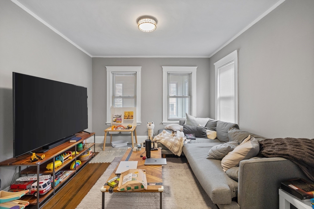14-16 Malvern Avenue Somerville, MA 02144 - Photo 21 of 39 a living room with furniture and a flat screen tv