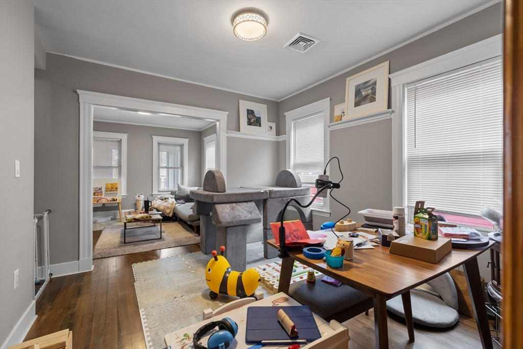 14-16 Malvern Avenue Somerville, MA 02144 - Photo 22 of 39 a work room with furniture and wooden floor