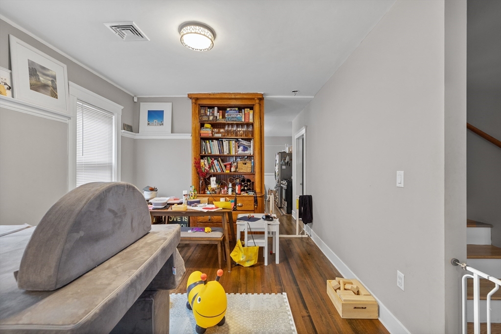 14-16 Malvern Avenue Somerville, MA 02144 - Photo 23 of 39 a living room with furniture and a wooden floor