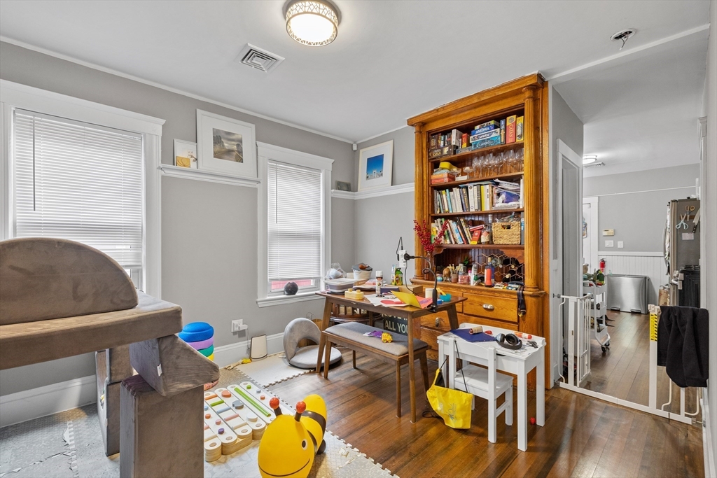 14-16 Malvern Avenue Somerville, MA 02144 - Photo 24 of 39 a room with furniture a rug and a window