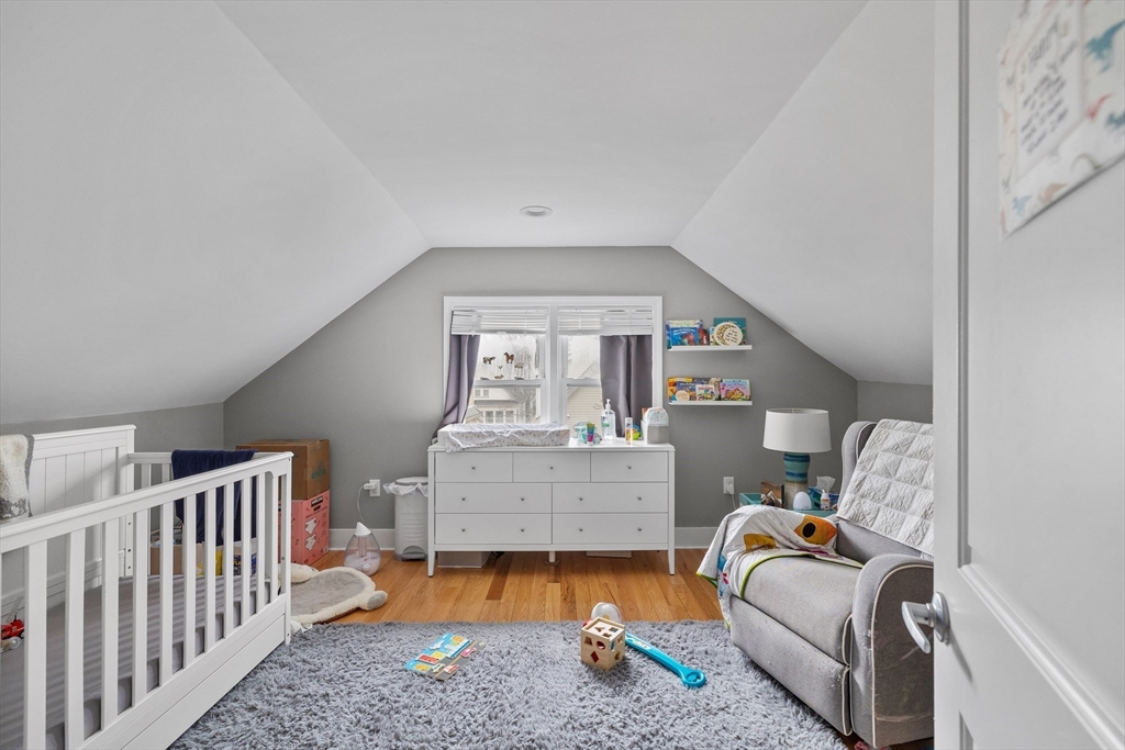 14-16 Malvern Avenue Somerville, MA 02144 - Photo 25 of 39 a bedroom with furniture and a window