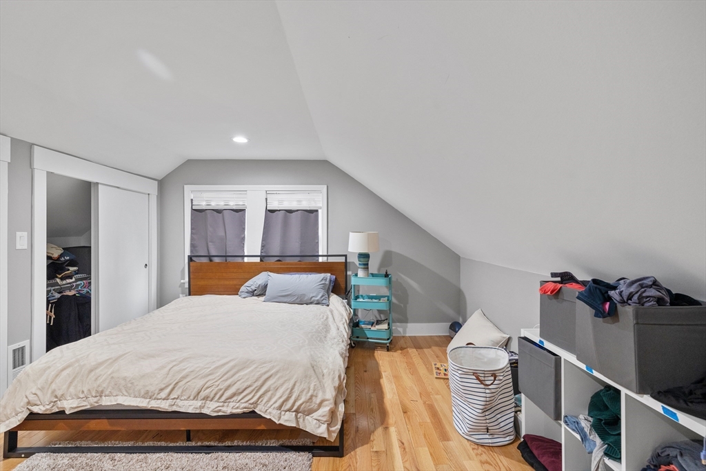 14-16 Malvern Avenue Somerville, MA 02144 - Photo 27 of 39 a bed room with a bed and a couch