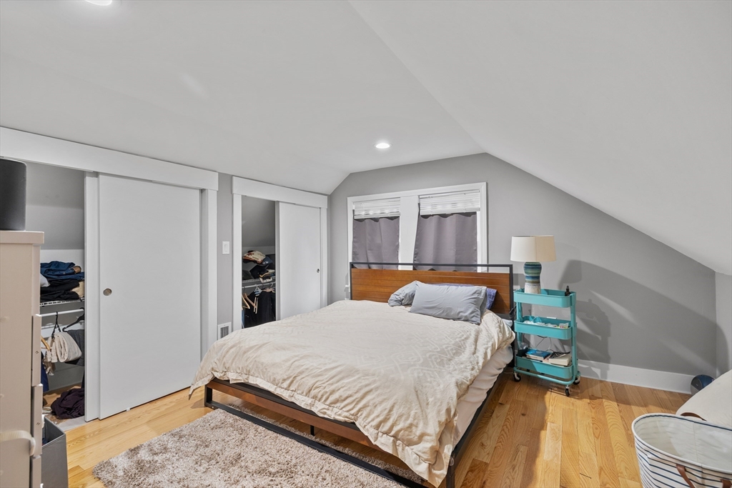 14-16 Malvern Avenue Somerville, MA 02144 - Photo 28 of 39 a bedroom with a bed and a window