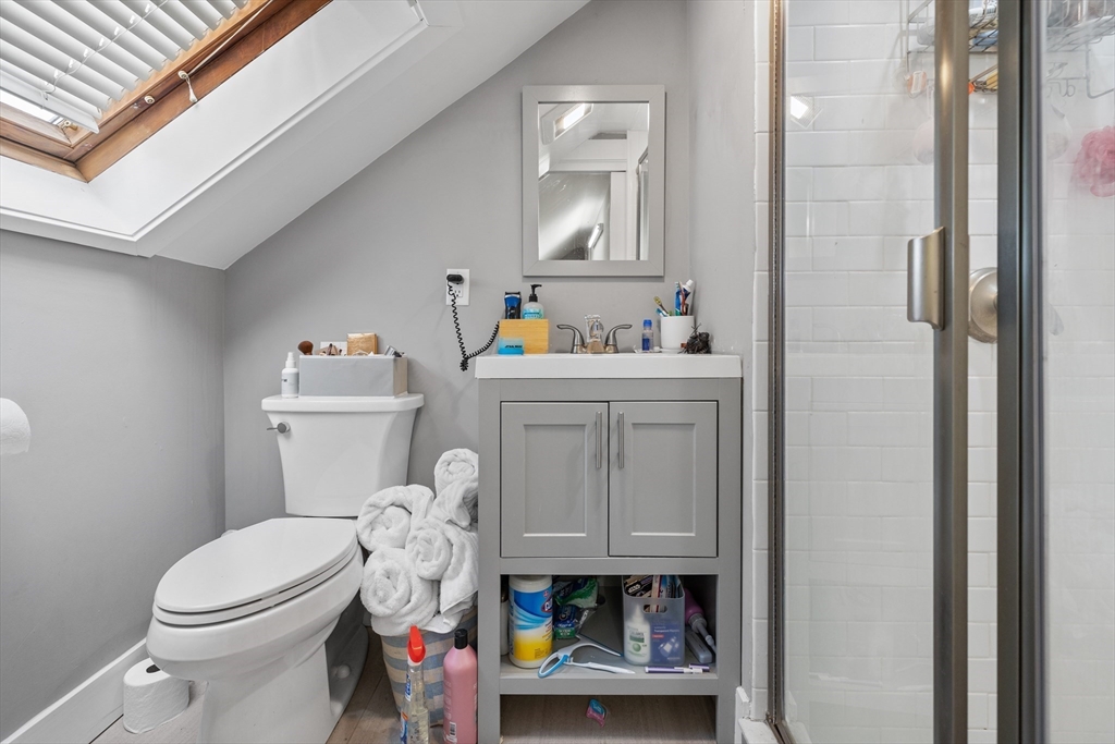 14-16 Malvern Avenue Somerville, MA 02144 - Photo 29 of 39 a white toilet sitting next to a bathroom sink