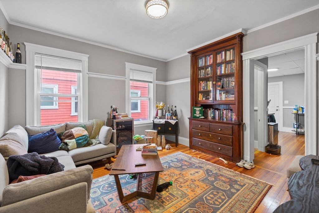 14-16 Malvern Avenue Somerville, MA 02144 - Photo 3 of 39 a living room with furniture and a window