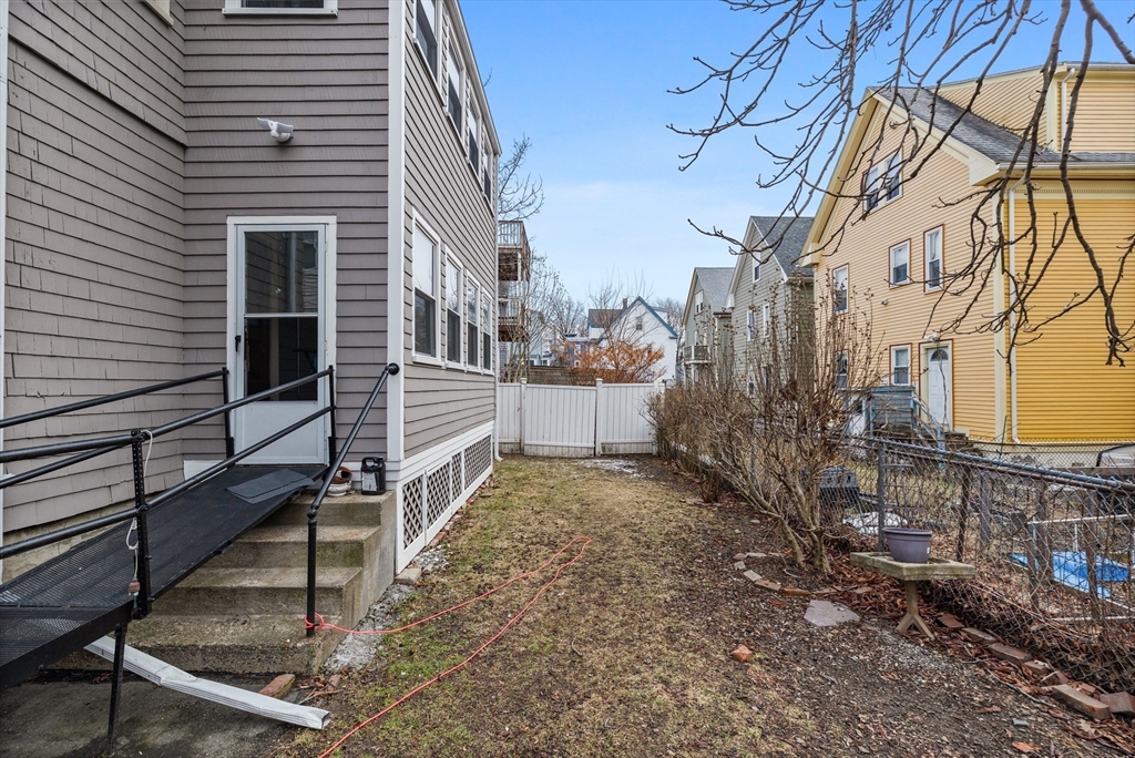 14-16 Malvern Avenue Somerville, MA 02144 - Photo 36 of 39 a view of a house with a yard