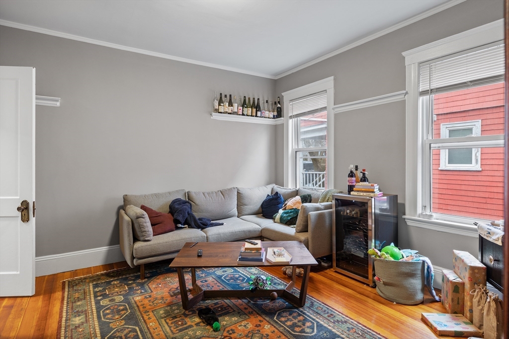 14-16 Malvern Avenue Somerville, MA 02144 - Photo 4 of 39 a living room with furniture and a window
