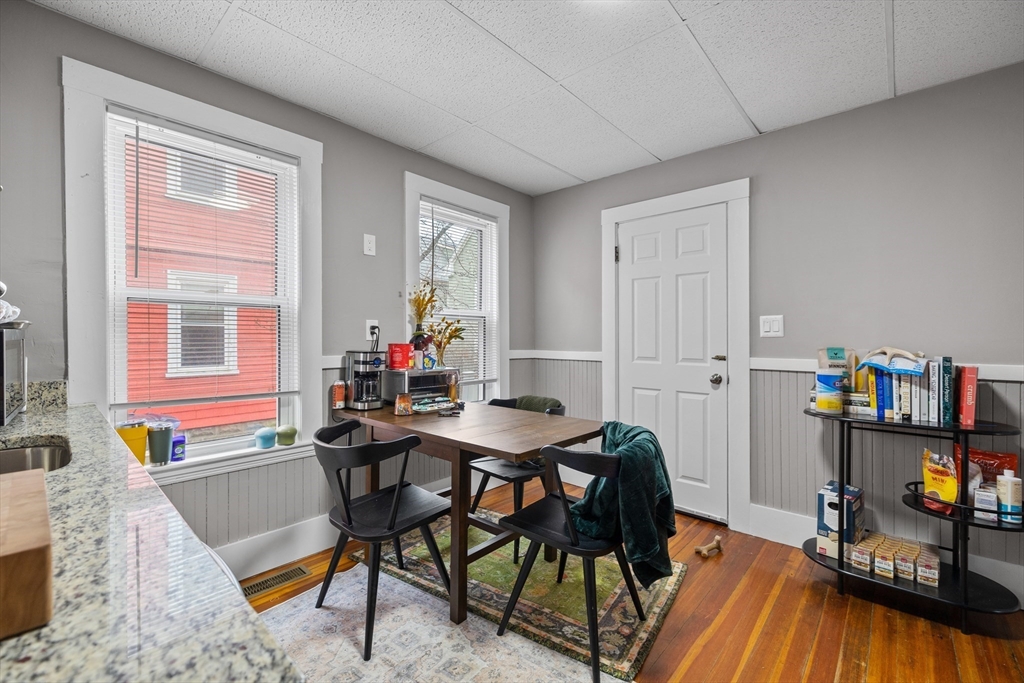 14-16 Malvern Avenue Somerville, MA 02144 - Photo 5 of 39 a view of a workspace with furniture and toys