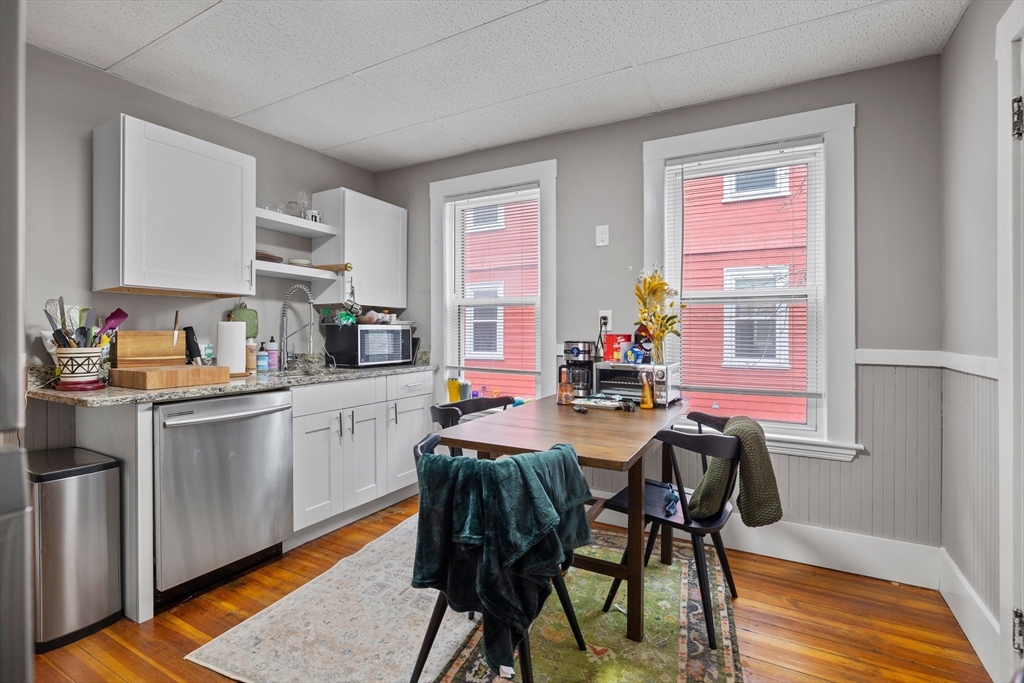 14-16 Malvern Avenue Somerville, MA 02144 - Photo 6 of 39 a view of a dining room with furniture and a window