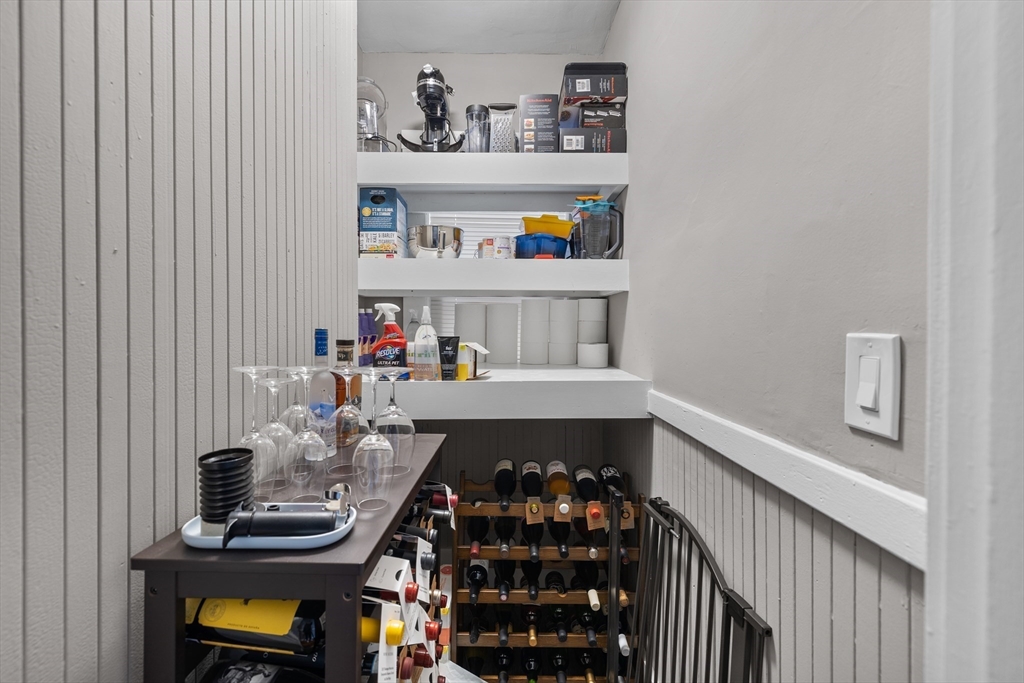 14-16 Malvern Avenue Somerville, MA 02144 - Photo 9 of 39 a room with furniture and book shelf