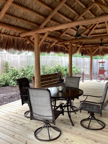 a patio with table and chairs