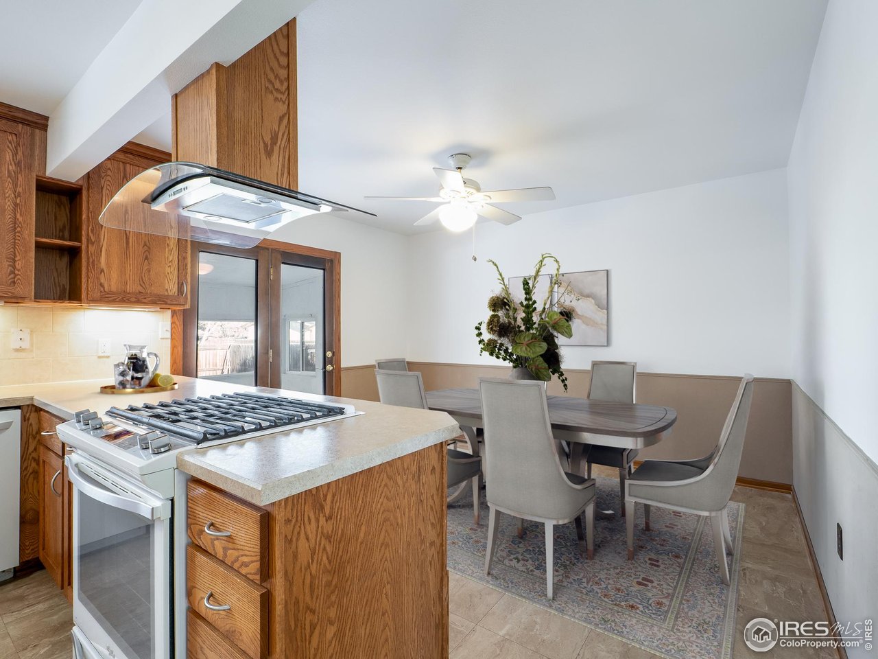 14 Daisy Court Windsor, CO 80550 - Photo 16 of 42 Virtually Staged Photo of the Kitchen and Dining