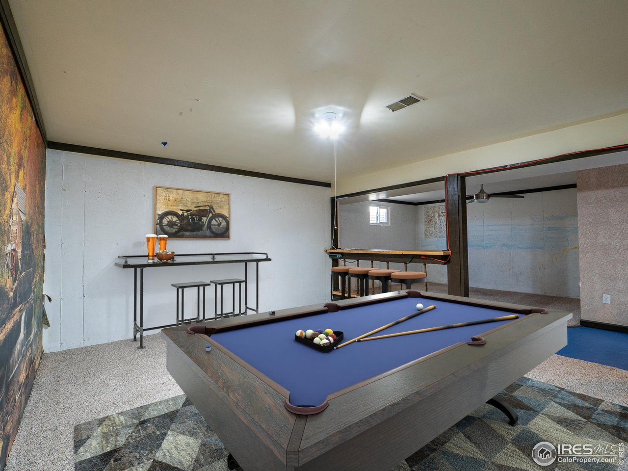 14 Daisy Court Windsor, CO 80550 - Photo 27 of 42 Basement Rec Room Virtually Staged