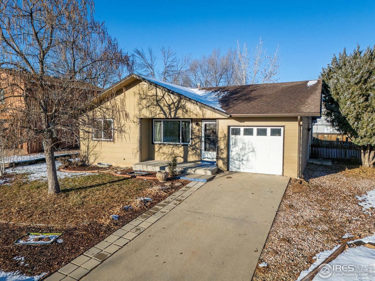 14 Daisy Court Windsor, CO 80550 - Photo 36 of 42 RV Parking and extra parking for a car on the side of the house