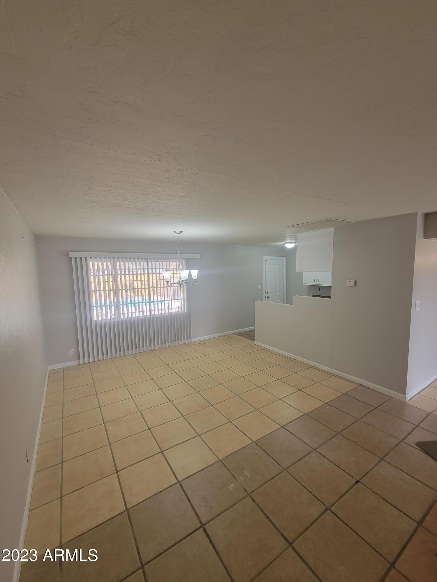 6518 North 41st Avenue Phoenix, AZ 85019 - Photo 2 of 13 a view of an empty room and window