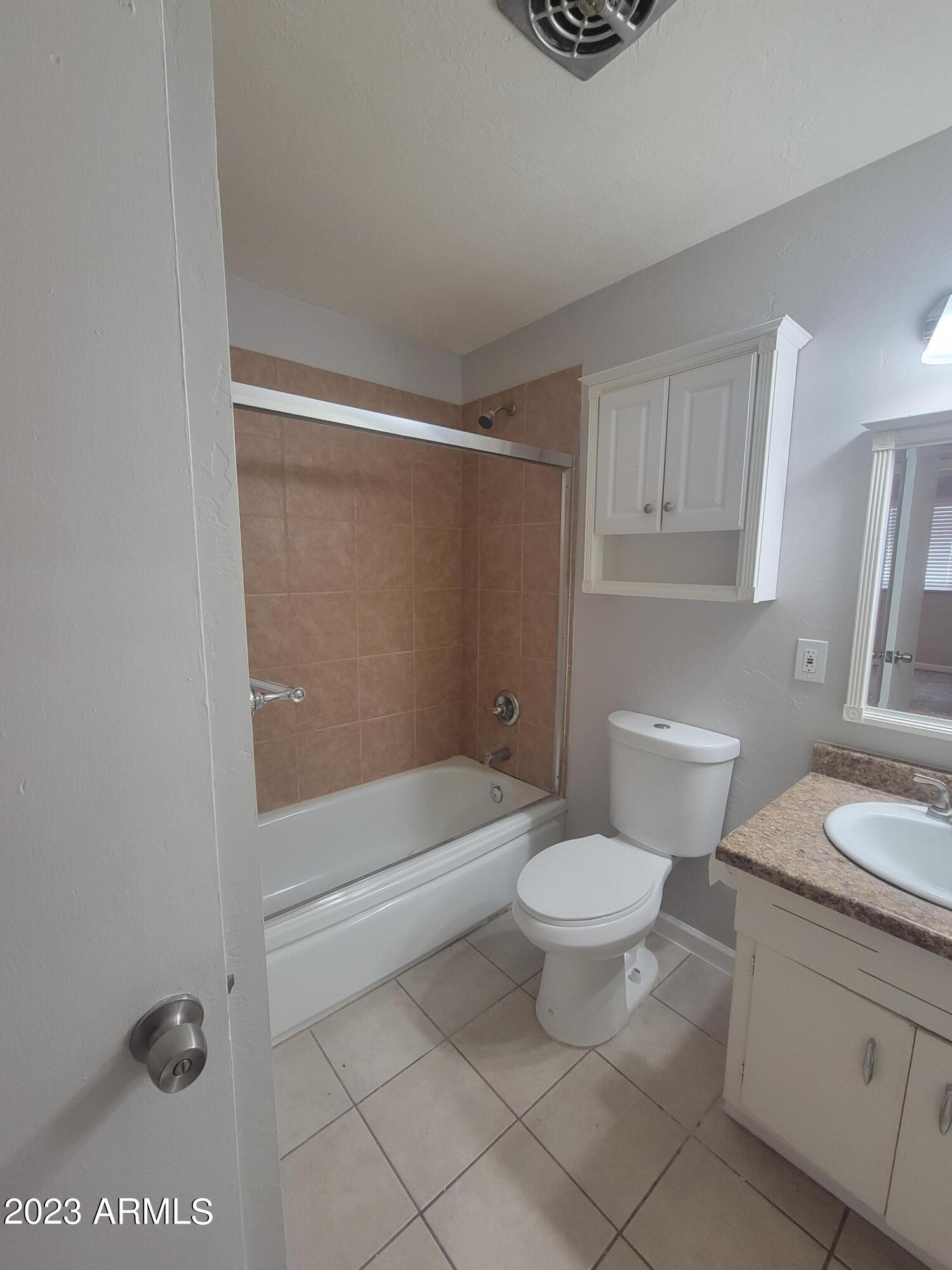 6518 North 41st Avenue Phoenix, AZ 85019 - Photo 7 of 13 a bathroom with a toilet a sink and shower