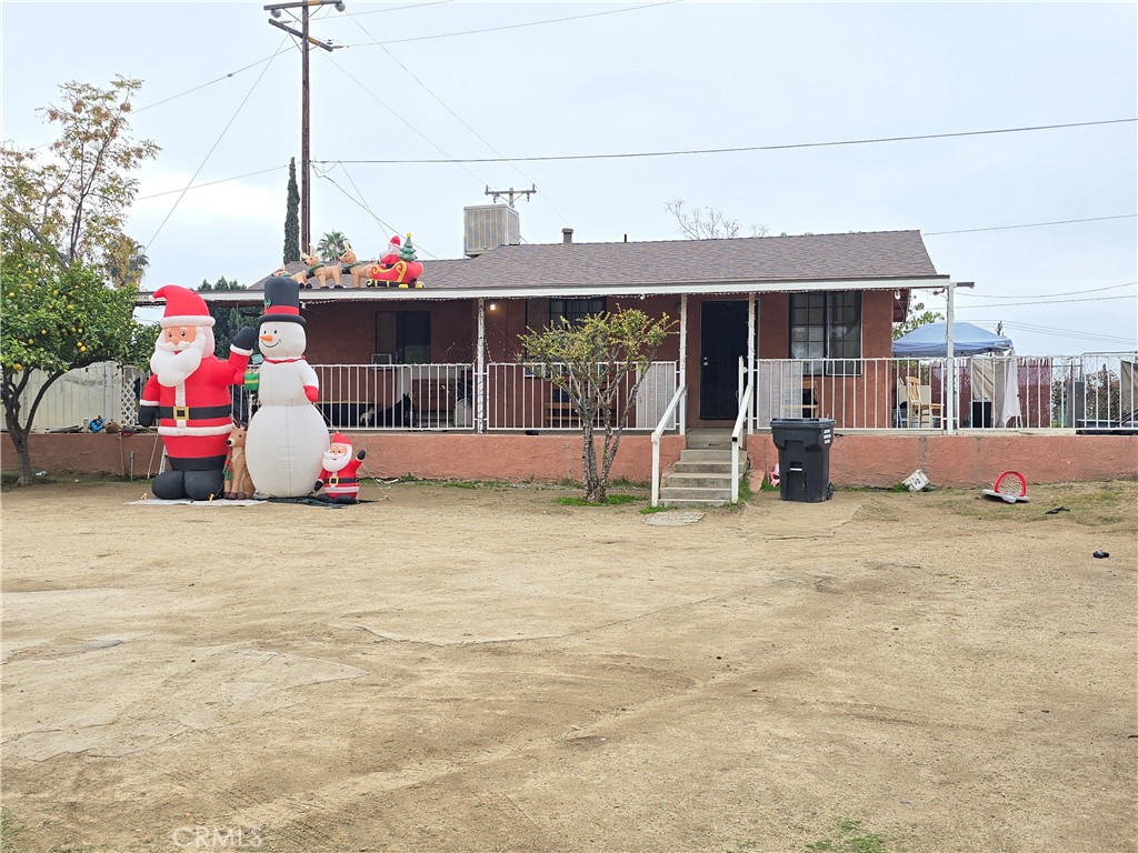 a front view of house with outdoor seating