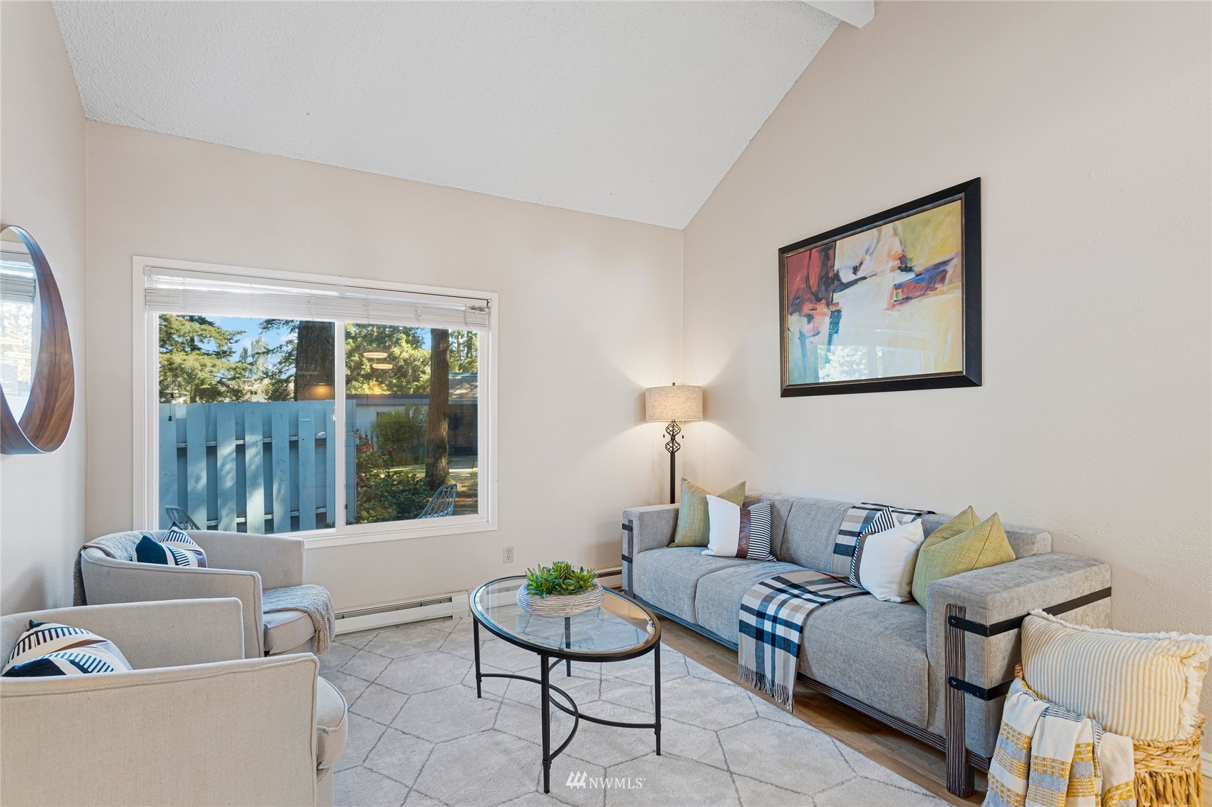 4308 Northeast Sunset Boulevard, Unit O2 Renton, WA 98059 - Photo 1 of 22 a living room with furniture and a large window
