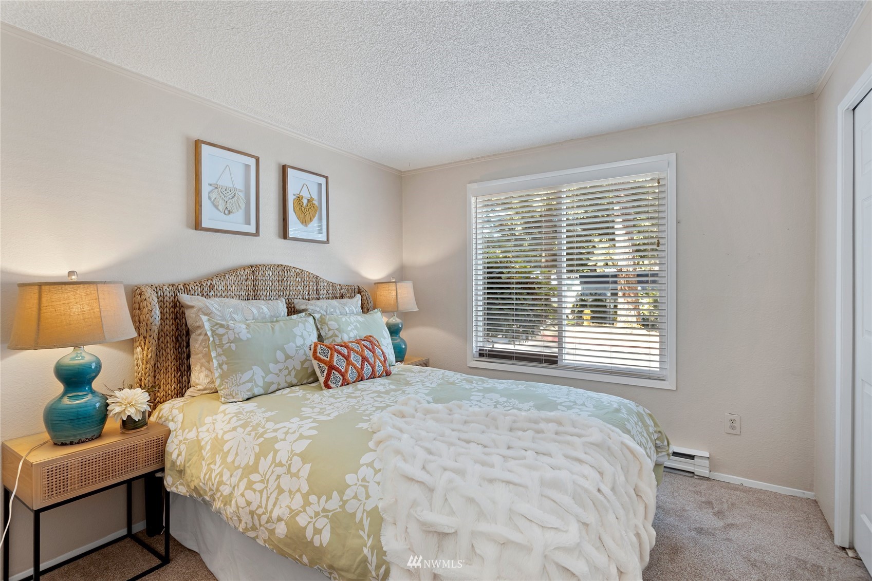 4308 Northeast Sunset Boulevard, Unit O2 Renton, WA 98059 - Photo 13 of 22 a bedroom with a bed and a window