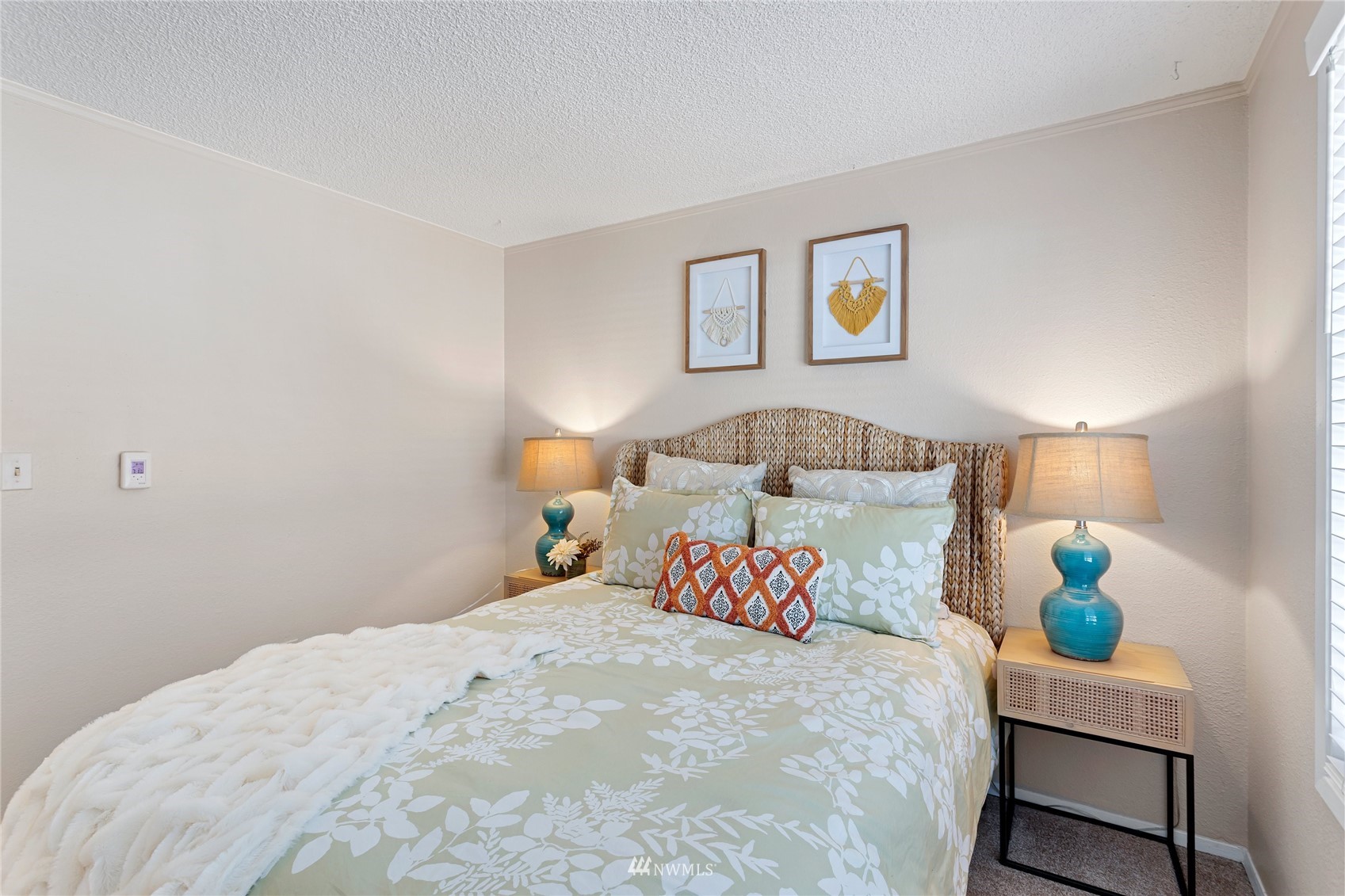 4308 Northeast Sunset Boulevard, Unit O2 Renton, WA 98059 - Photo 14 of 22 a bedroom with a bed and a lamp on table