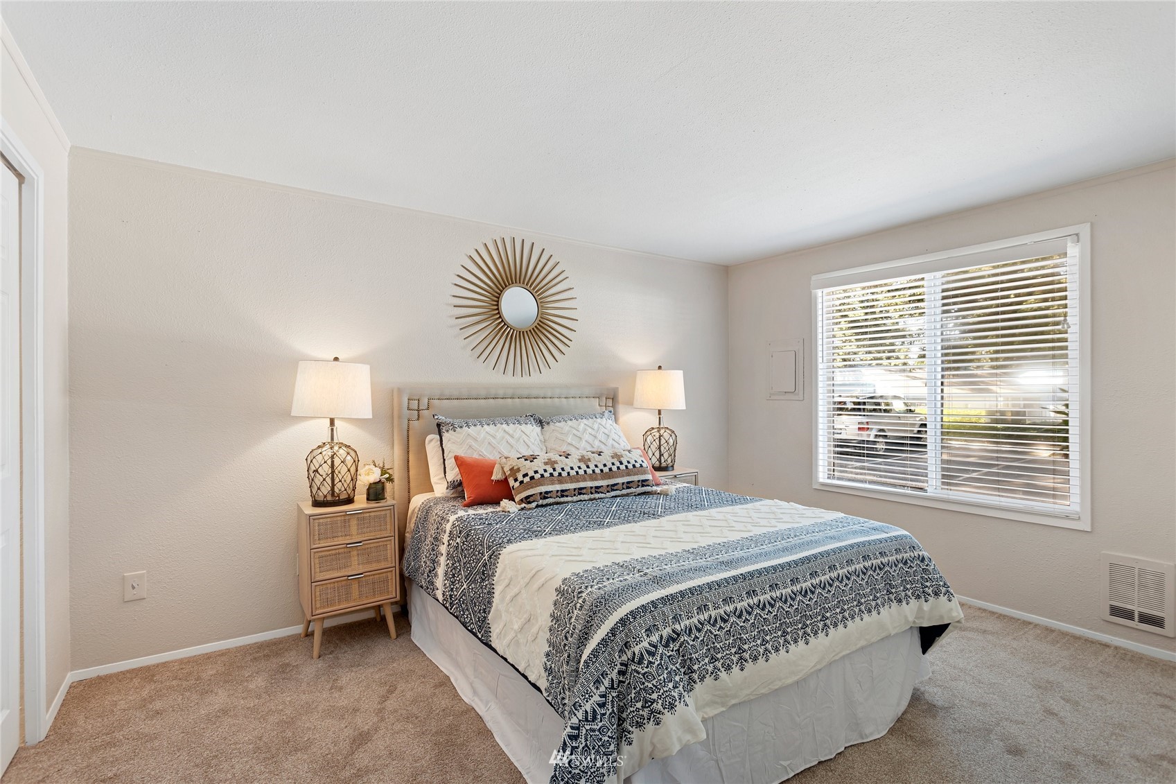 4308 Northeast Sunset Boulevard, Unit O2 Renton, WA 98059 - Photo 16 of 22 a bedroom with a bed and a window