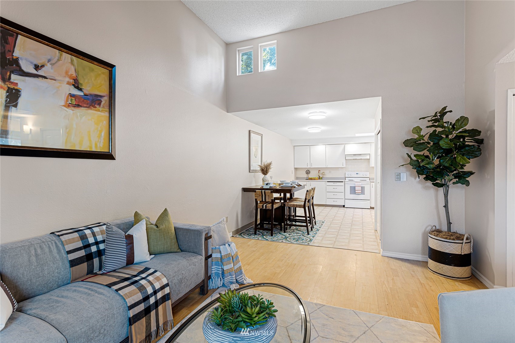 4308 Northeast Sunset Boulevard, Unit O2 Renton, WA 98059 - Photo 3 of 22 a living room with furniture and a potted plant