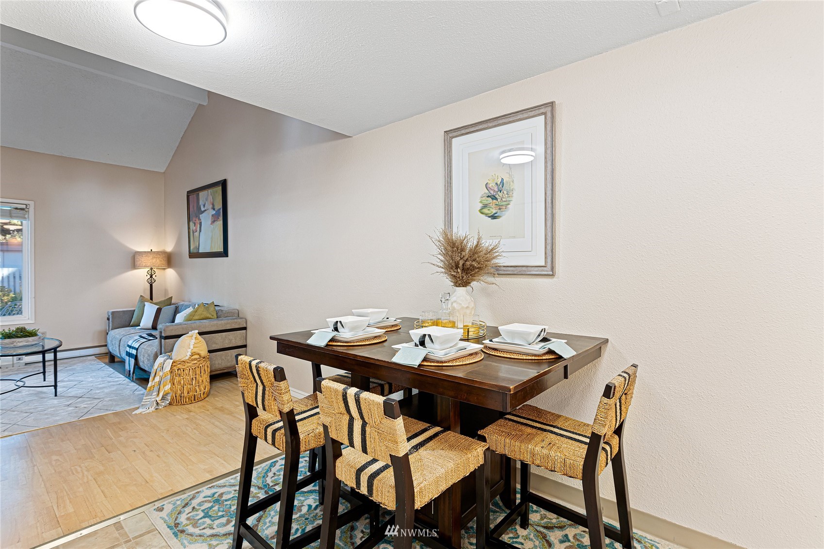 4308 Northeast Sunset Boulevard, Unit O2 Renton, WA 98059 - Photo 5 of 22 a view of a dining room with furniture and wooden floor