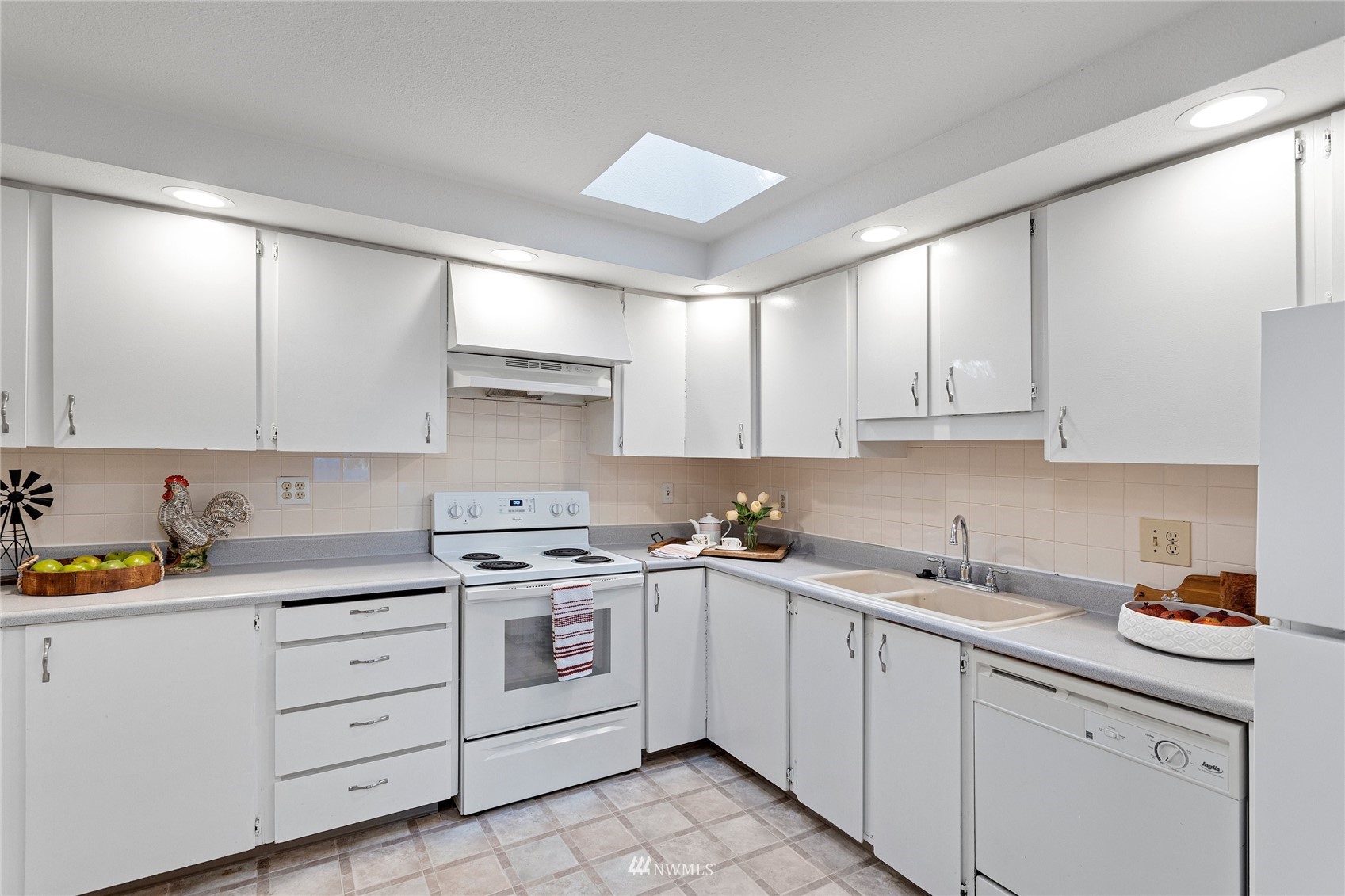 4308 Northeast Sunset Boulevard, Unit O2 Renton, WA 98059 - Photo 7 of 22 a kitchen with cabinets appliances a sink and a cabinets