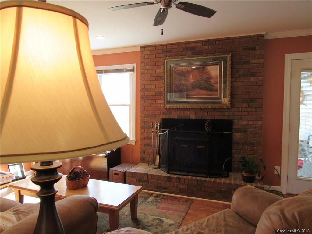 1219 Stevens Road Monroe, NC 28110 - Photo 12 of 24 a living room with furniture a window and a fireplace