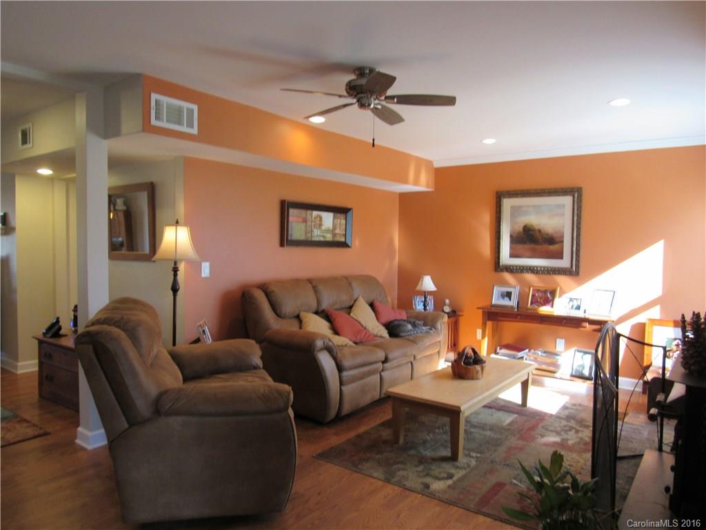 1219 Stevens Road Monroe, NC 28110 - Photo 13 of 24 a living room with furniture and a lamp