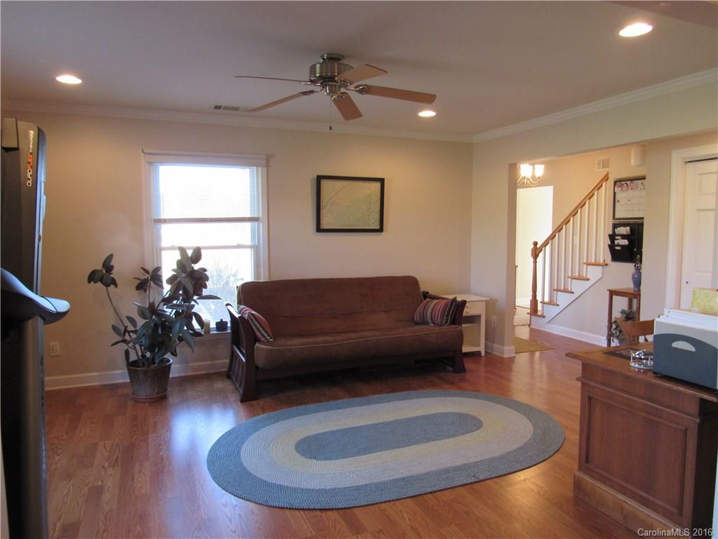 1219 Stevens Road Monroe, NC 28110 - Photo 14 of 24 a living room with furniture and a wooden floor