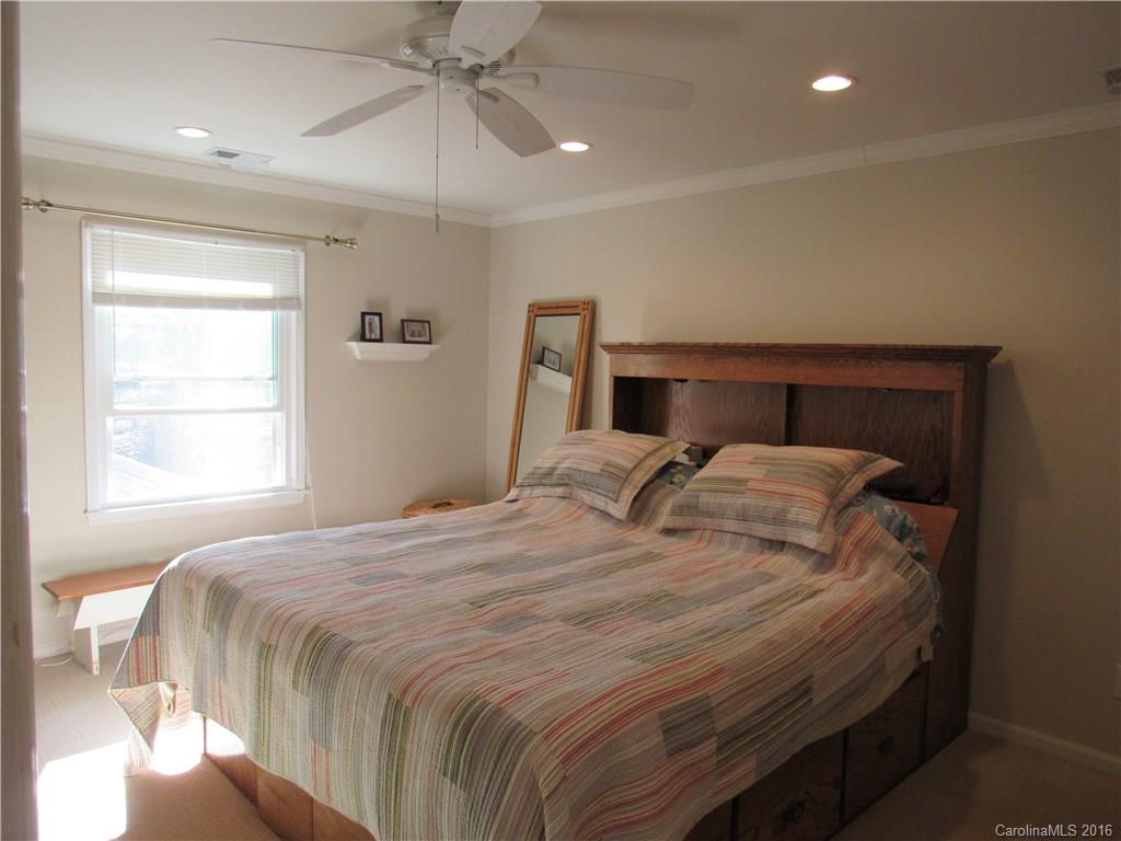 1219 Stevens Road Monroe, NC 28110 - Photo 18 of 24 a bedroom with a bed and a window