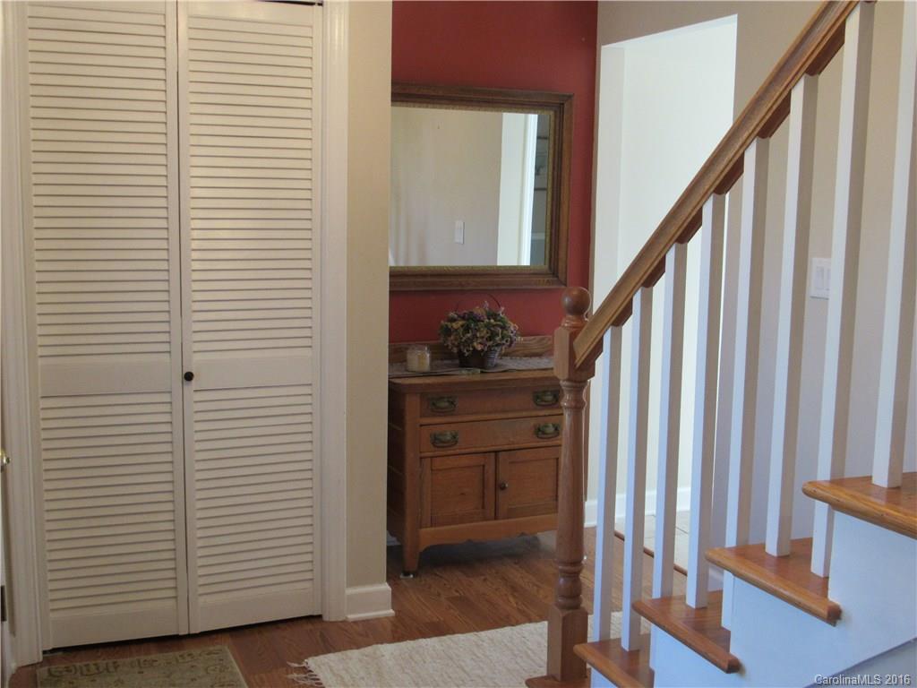 1219 Stevens Road Monroe, NC 28110 - Photo 3 of 24 a view of a hallway with entryway wooden floor and staircase