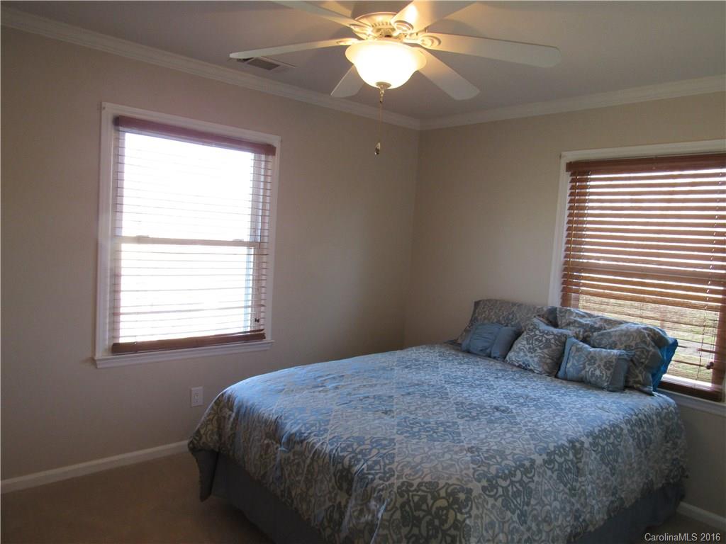 1219 Stevens Road Monroe, NC 28110 - Photo 22 of 24 a bedroom with a bed and a window