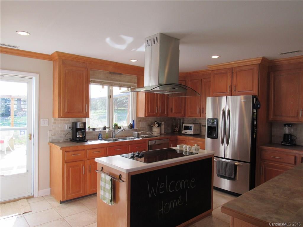 1219 Stevens Road Monroe, NC 28110 - Photo 5 of 24 a kitchen with stainless steel appliances a sink stove and refrigerator