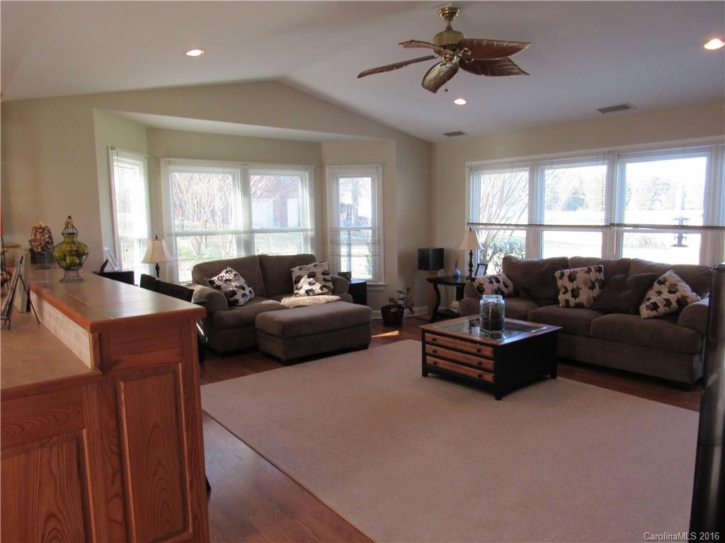 1219 Stevens Road Monroe, NC 28110 - Photo 8 of 24 a living room with furniture ceiling fan and a window