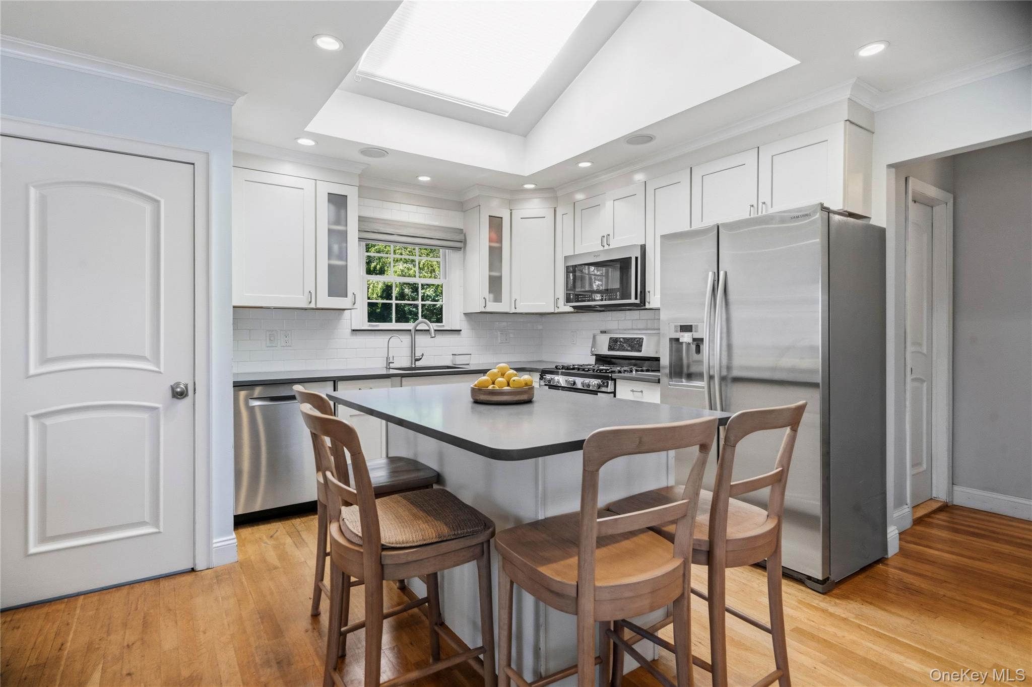 190 Sexton Road West Babylon, NY 11704 - Photo 13 of 28 a kitchen with stainless steel appliances a refrigerator a stove a microwave and chairs