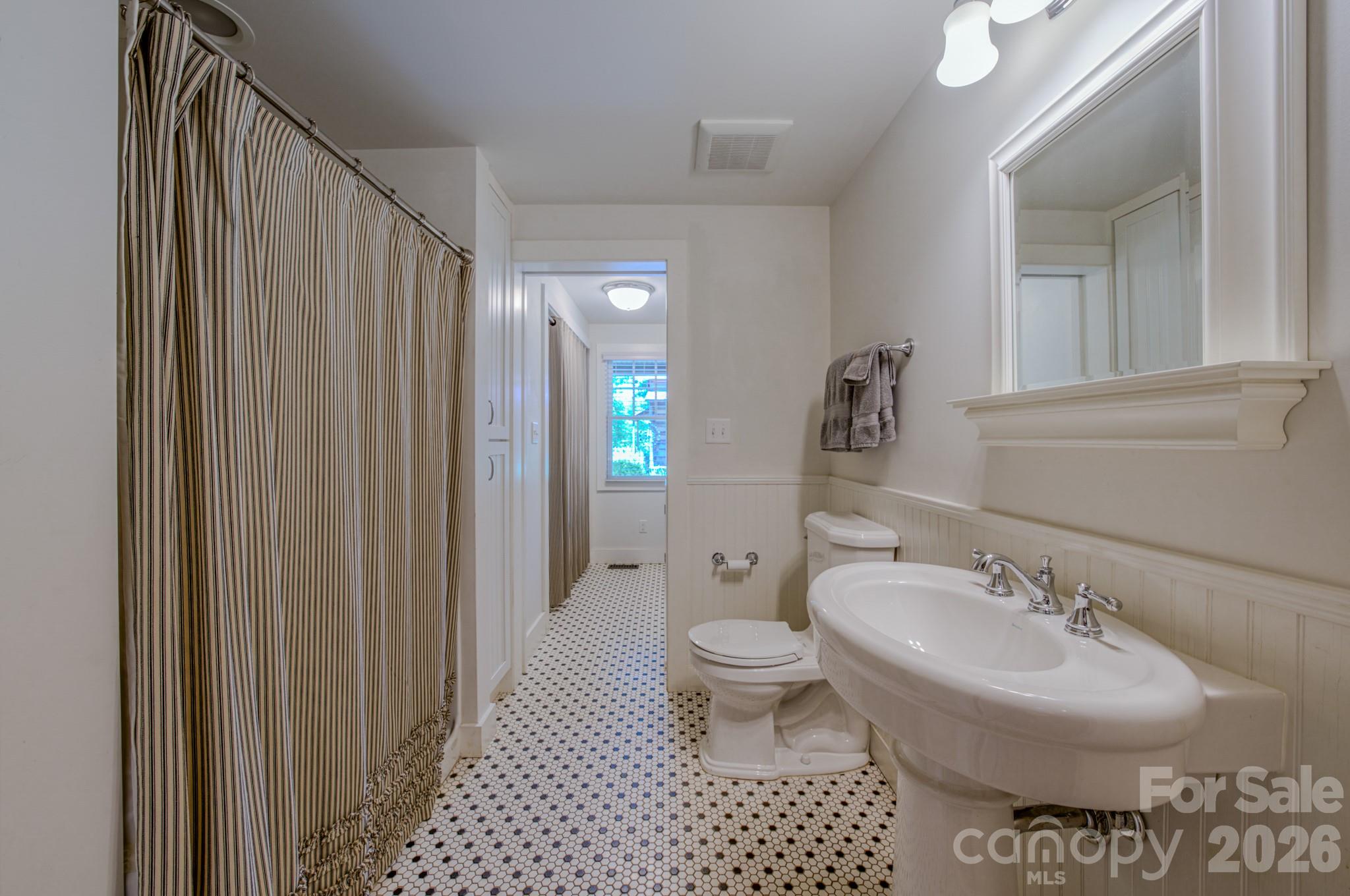 75 Old Gap Creek Road Fairview, NC 28730 - Photo 24 of 43 a bathroom with a sink toilet and shower