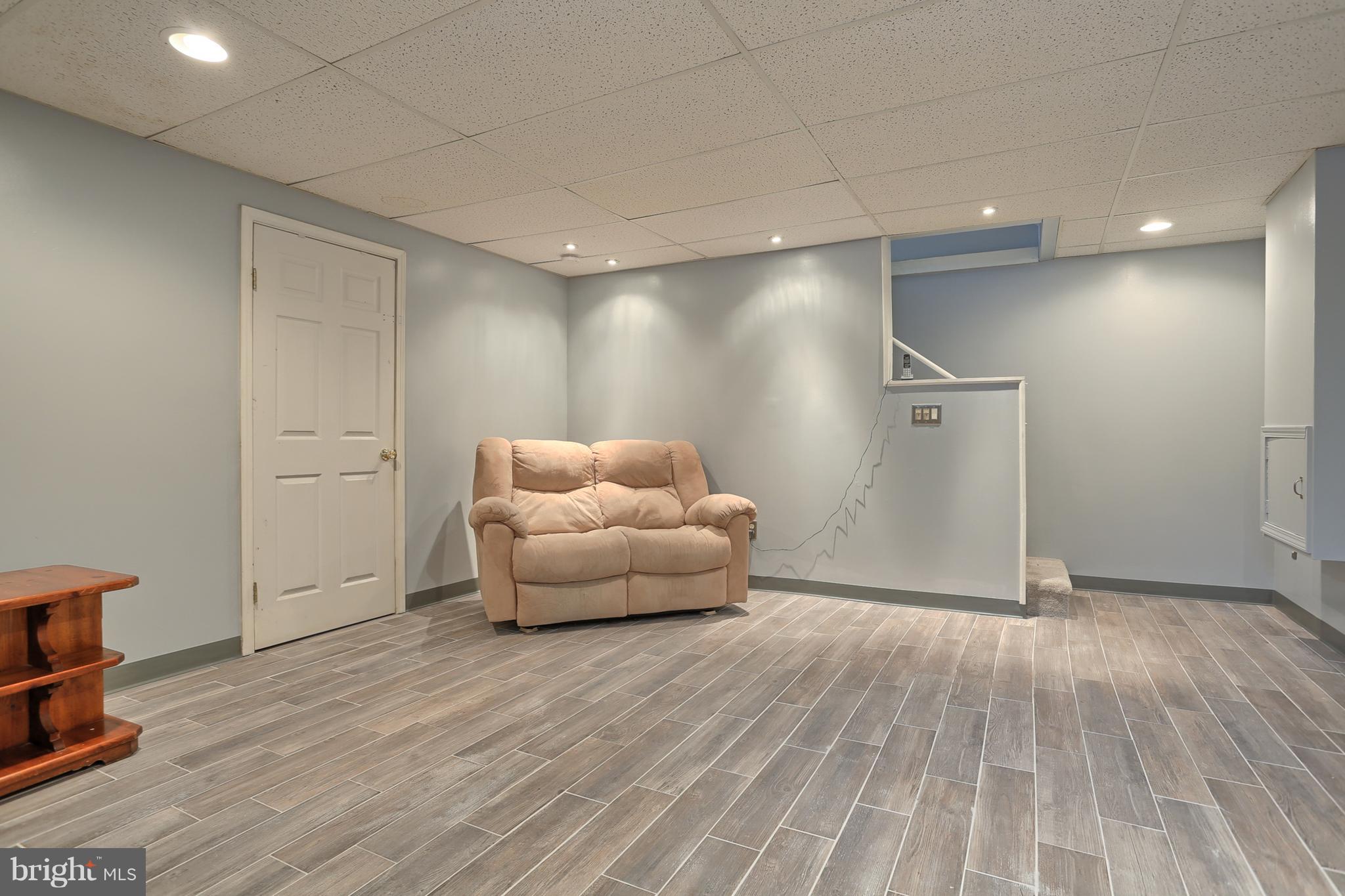 661 East Derry Road Hershey, PA 17033 - Photo 18 of 28 Trendy flooring & recessed lights in LL family rm