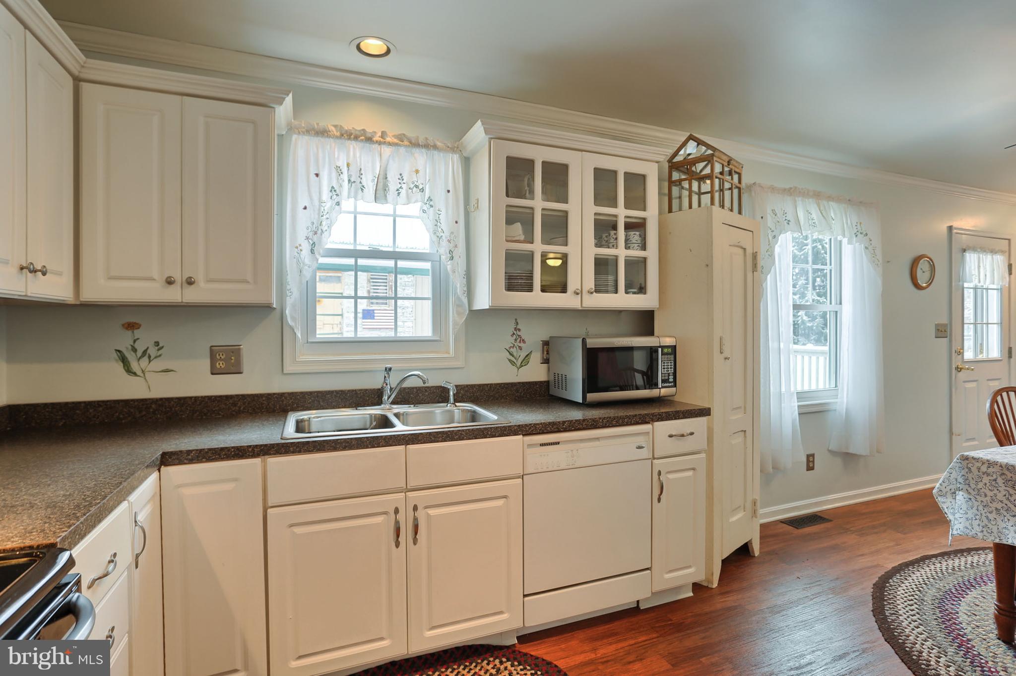 661 East Derry Road Hershey, PA 17033 - Photo 6 of 28 Cheerful kitchen highlighted w/crown mold & new fl