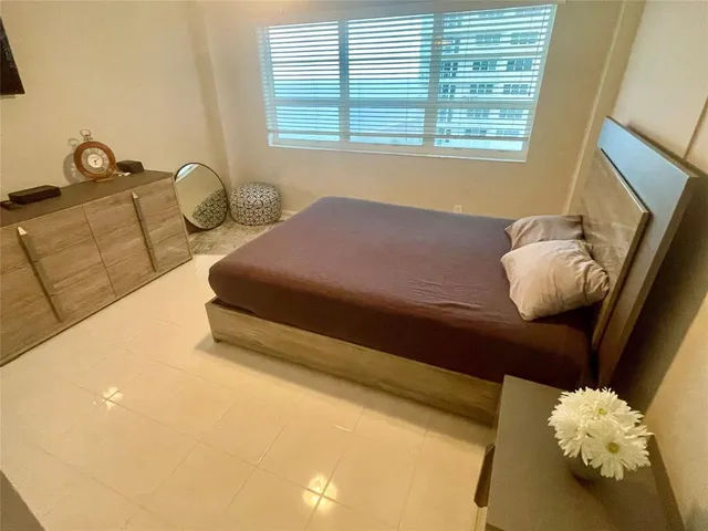 a bathroom with a sink toilet and mirror
