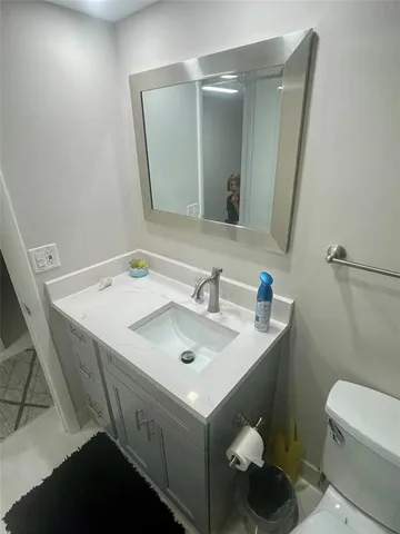 a view of an empty room and floor to ceiling window